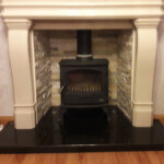Multi fuel stove in marble inset and large marble mantle