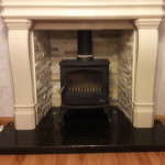 Multi fuel stove in marble inset and large marble mantle